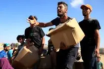  تصاویر  هجوم هزاران فلسطینی برای کمک دلخراش است
