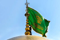 تعویض پرچم گنبد امام رضا(ع) به رنگ سبز