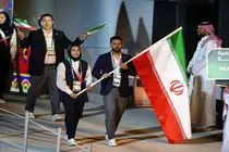 پرچمداری علیرضا معینی و مریم بربط در مراسم بازی‌های کشورهای اسلامی ریاض